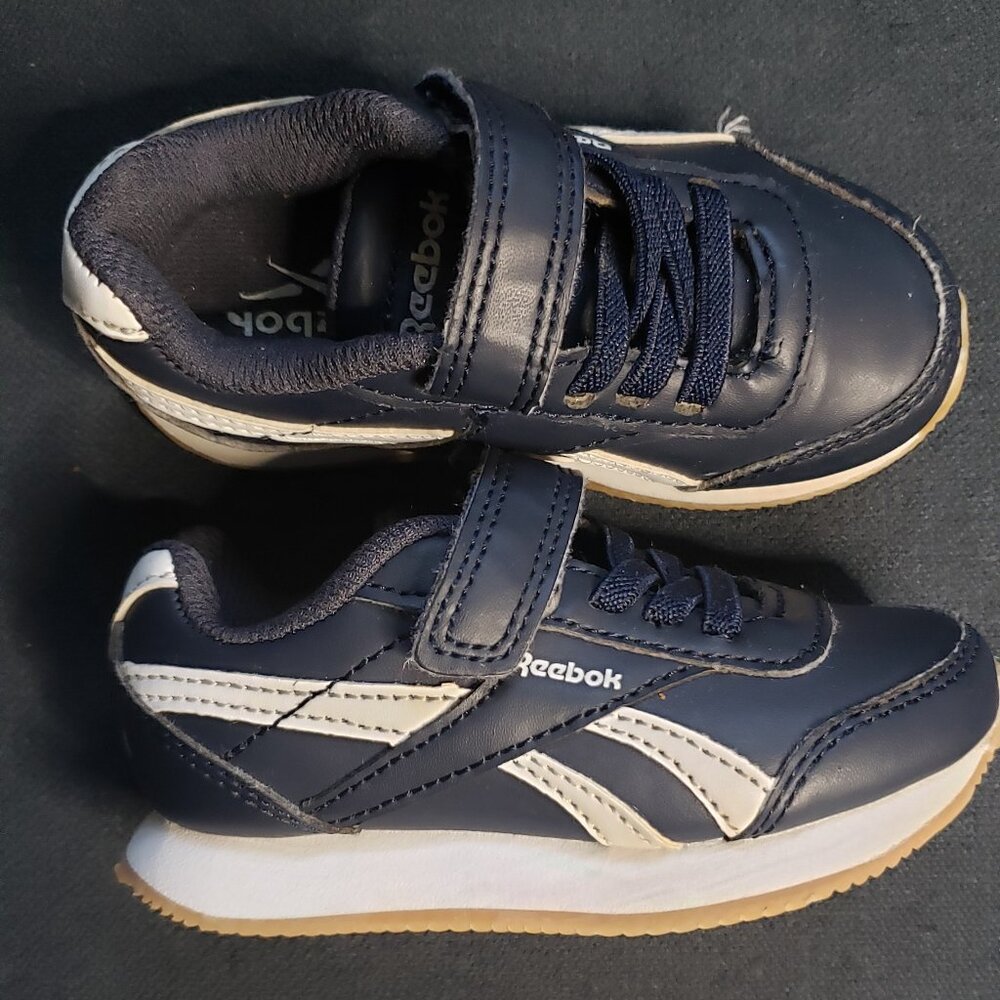 Blue and white Reebok Size 6